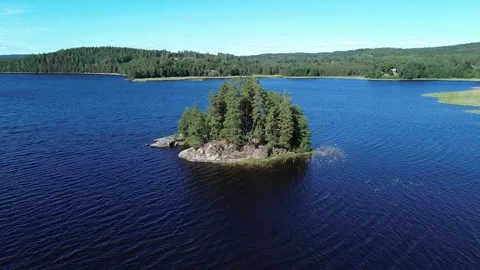 Drone 360 Orbit Around Small Island in Ivag Lake, Sweden Stock Footage 321250761