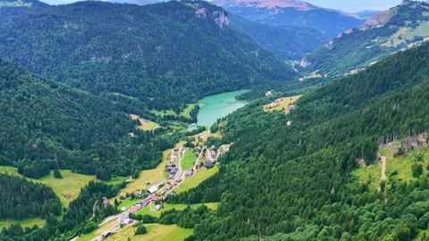Drone 4K aerial flight over alpine lake and forest valley Stock Footage 331658416