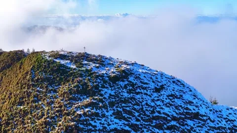 Drone 4K aerial orbit over snowy alpine summit with fog and Lake Leman Stock Footage 330658686
