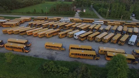 Drone 4k Aerial Video elementary school bus depot country Stock Footage 79074606