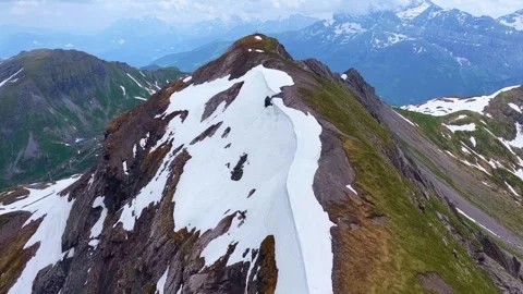 Drone 4K aerial view alpine ridge with snow forward motion Stock Footage 331632167