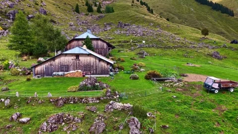 Drone 4K alpine farm chalet in mountain pasture France Stock Footage 330540392