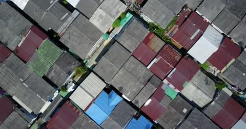 Drone - 4K - Klong Toey rooftops to a High-rise CBD city reveal Stock Footage 159581387