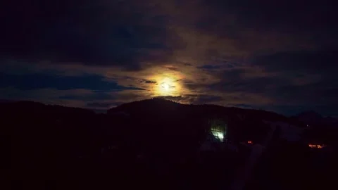 Drone 4K night flight under moon above alpine forest Stock Footage 329912369