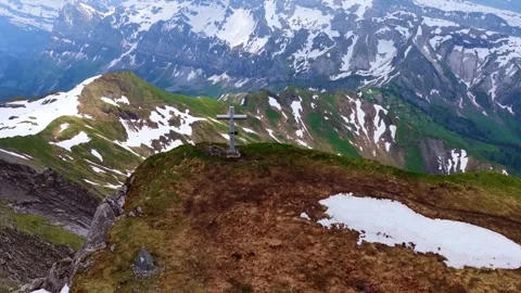 Drone 4K orbit alpine summit cross mountain landscape Stock Footage 331632342