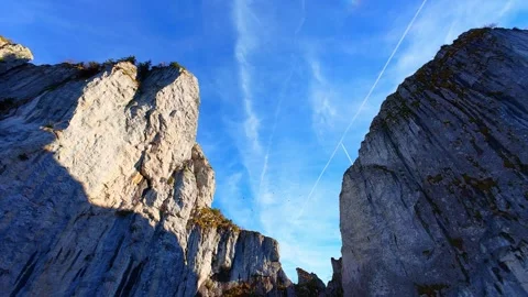 Drone 4K pullback revealing dramatic alpine cliffs Stock Footage 330656039