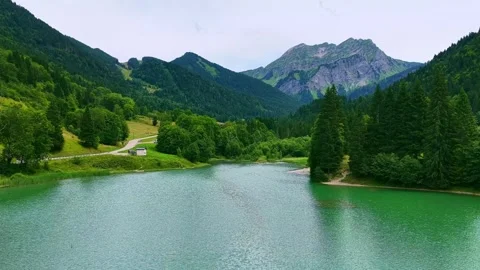 Drone 4K slow flight over alpine lake and forest Stock Footage 331658814