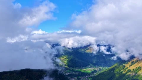 Drone 4K Timelapse Clouds Moving Over Alpine Valley Stock Footage 332052034