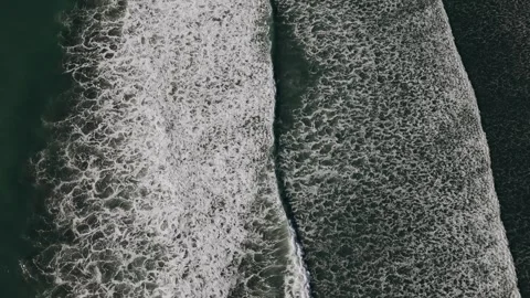Drone 4k top down view waves coastline new zeland Stock Footage 311310231