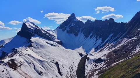 Drone 4K view toward snowy alpine ridge in Haute-Savoie Stock Footage 334376052