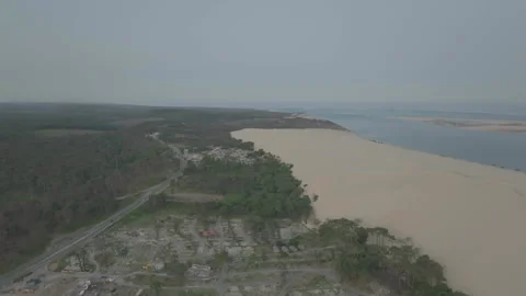 Drone above forest and deforested area with Dune du Pilat on right, France Видео 333107955
