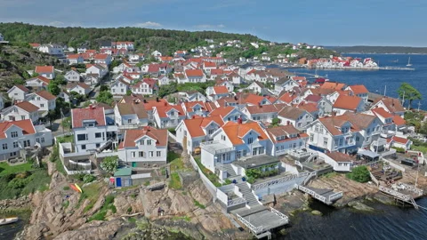 Drone above hillside homes in Risor Norway showing traditional wooden houses. Stock Footage 328125972