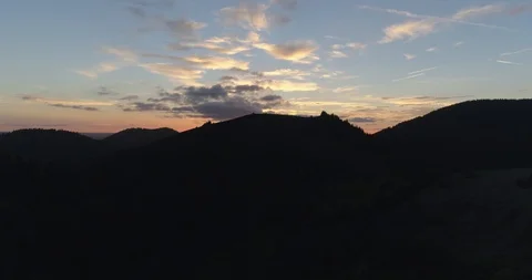 Drone above mountains until a sunset Stock Footage 125996383