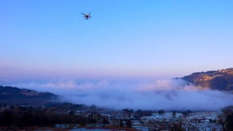 Drone above rice paddy fields and in front of sea of clouds Stock Photos