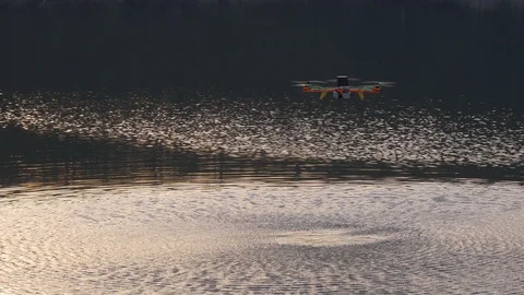 Drone above the water creates ripples on the water by propellers Stock Footage 88620058