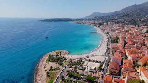 Drone Advances Over Menton Toward Curved Beach Stock Footage 345998096
