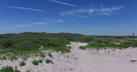 Drone, aerial 4k footage. Drifting over Rockaway Beach, in Queens, New York. Stock Footage