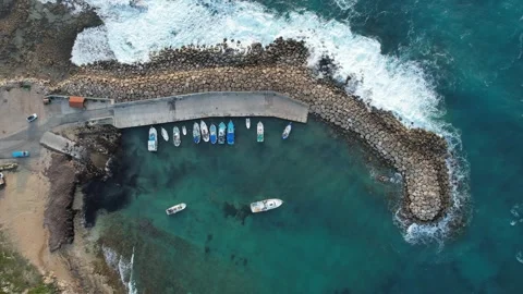 Drone Aerial 4k resolution  view of fishing boats docked in a small harbor 動画素材 322071494