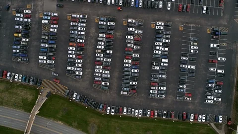 Drone aerial bird's eye view looking straight down on cars in parking lot Stock Footage 104809358