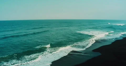 Drone aerial capturing turquoise ocean waves moving across tropical reef Stock Footage 329461215