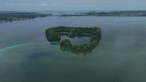 Drone aerial circling De Schelp island in Gooimeer, Netherlands Stock Footage 339683865