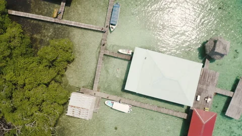 Drone aerial circular view on the floating overwater houses and boats Stock Footage 142742100
