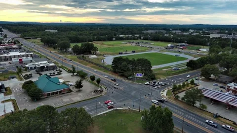 Drone aerial of city intersection traffic moving east to west Stock Footage 202205461