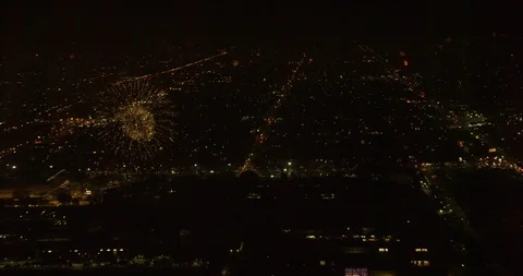 Drone aerial close up on fireworks exploding over city, night Stock Footage 102205236