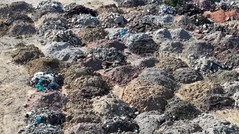 Drone aerial dump site with rows of debris and soil piles Stock Footage 329361679