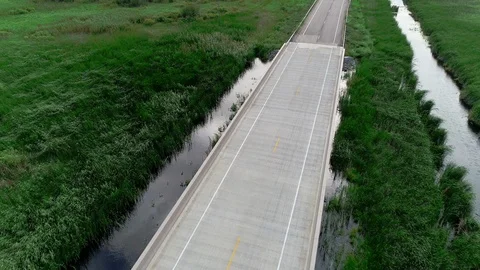 Drone aerial of empty highway bridge on rural road. Видео 116358451
