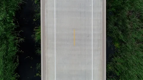 Drone aerial of empty highway bridge on rural road. 動画素材 116358650