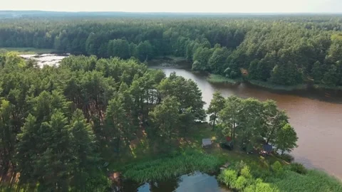 Drone aerial flight over forest, islands, swamp and village. Skies reflection Stockbeeldmateriaal 170128892