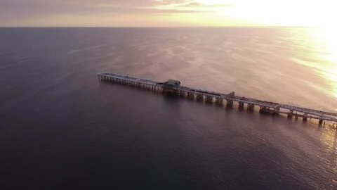 Drone aerial flight over ocean at Busselton jetty at sunrise Stock-Footage 302574469