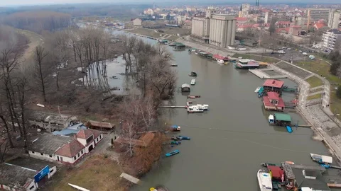 Drone aerial flight over river, river rafts and boats Stock Footage 97765935