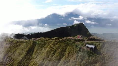 Drone Aerial Fly through Clouds Mount Batur Bali Video stock 330472188