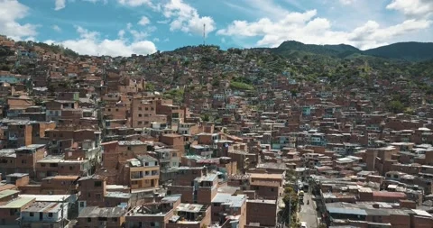 Drone aerial flying over comuna 13 slums in medellin neighborhood, Stock Footage 141168073
