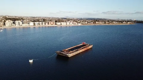 Drone aerial footage of empty dredging barge moored in bay 库存影片 86292477