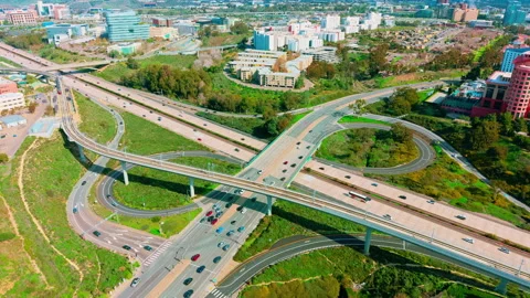 Drone aerial of freeway interchange with moving traffic creating complex roads Stockbeeldmateriaal 330516623