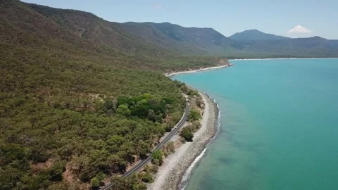 Drone aerial going lower and parallax over tropical blue water and beach Stock Footage 164719003