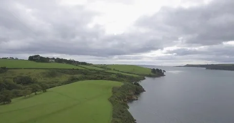 Drone aerial helford passage cornwall rise over tree water river 4k Stock Footage 79459098