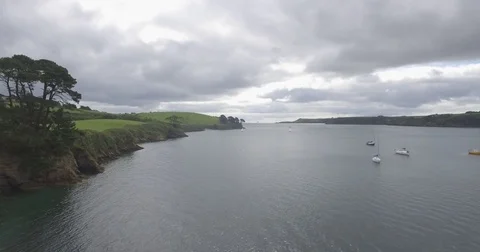 Drone aerial helford passage cornwall rise up river water boats 4k Stock Footage 79459375