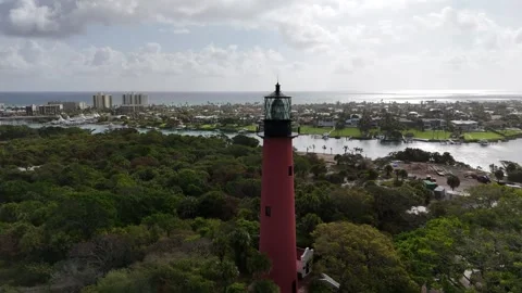 Drone Aerial of Jupiter Lighthouse Surrounded by Tropical Landscape Stock Footage 332172006