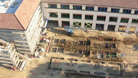 Drone Aerial Medium Close-Up On Building Construction Site Stock Footage 272701711