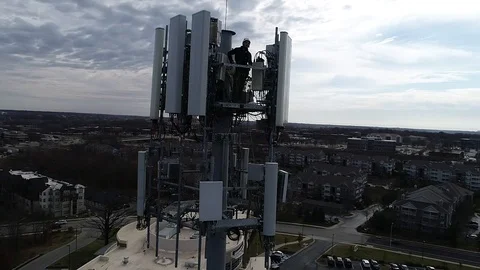 Drone Aerial Men Working Cell tower 2 Stock Footage 120885434