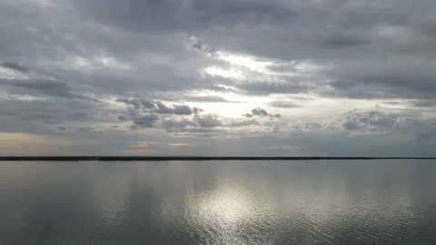 Drone aerial moving forward above a large lake that has small waves Stock Footage 234579385