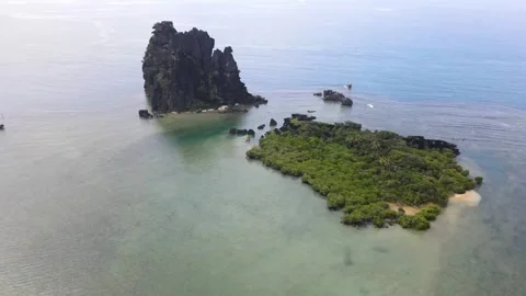 Drone aerial moving forward at La Poule in New Caledonia panning on a cloudy day Stock Footage 319060107