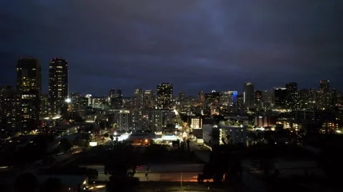 Drone aerial moving west toward G Street in downtown San Diego with city lights Stock Footage 332226528