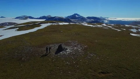 Drone Aerial Orbiting Men on Mountain Summit with Beautiful Thermal Inversion Video stock 81719422
