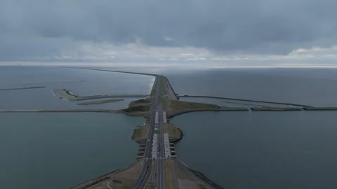 Drone aerial over the Afsluitdijk with traffic and open water in the Netherlands Stock Footage 343839416