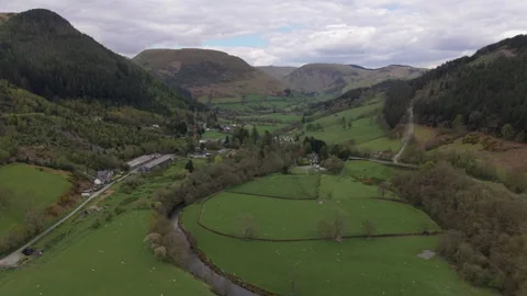Drone Aerial Over River And Green Countryside Valley In Wales 스톡 동영상 335721660
